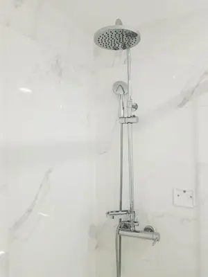 a shower with a shower head in a bathroom at Almada Downtown 202 in Porto