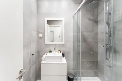 a bathroom with a sink and a shower at GuestReady - Studio in Porto in Porto