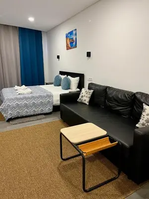 a living room with a couch and a bed at Almada Downtown 302 in Porto