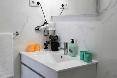 a bathroom with a sink and a mirror at Almada Downtown 304 in Porto