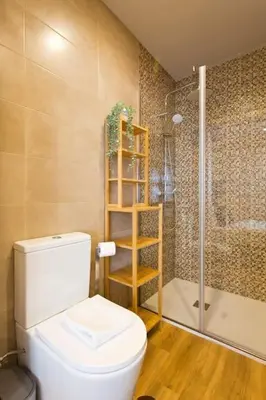 a bathroom with a toilet and a shower at APOSENTUS - Marta's House in Porto