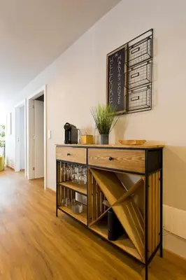 a wooden counter in a room with a table at APOSENTUS - Marta's House in Porto