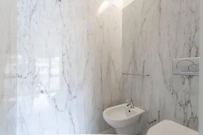 a white bathroom with a toilet and a sink at MY DOURO VIEW Stunning Apartment River Front in Vila Nova de Gaia