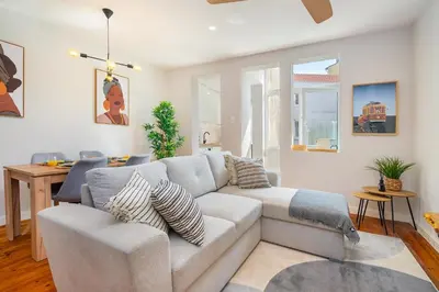a living room with a couch and a table at Whome Formosa #2 - Central 2-Bed in Prime Location Perfect to Explore Porto in Porto