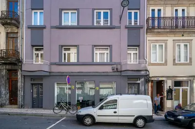 a white van parked in front of a building at Whome Formosa #3 - Central 2-Bed in Prime Location Perfect to Explore Porto in Porto
