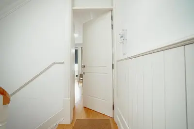 a hallway with a white closet and a door at Downtown Premium Apartment by Vacationy in Porto