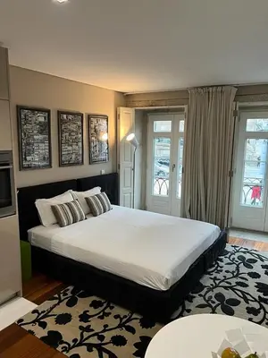 a bedroom with a large bed in a room at Oporto Chic & Cozy Cardosas in Porto