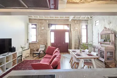 a living room with a couch and a table at Maison214 in Vila Nova de Gaia
