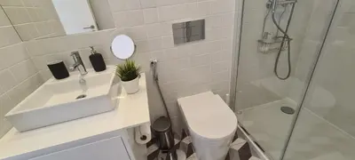 a bathroom with a toilet and a sink and a shower at Merc Porto Estudio 245 in Porto