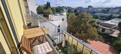a balcony with two chairs and a view of a city at Merc Porto Estudio 245 in Porto