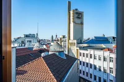 a view of a city with buildings and roofs at Plan C Downtown Apartment in Porto