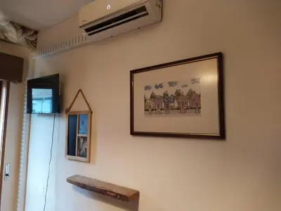 a picture hanging on a wall in a room at Porto Grand Sasimi House in Porto