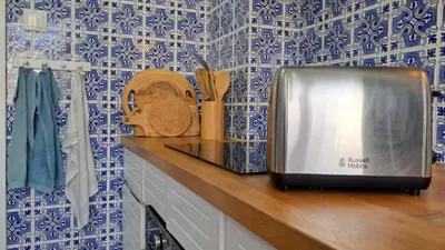 a kitchen counter with a sink and a coffee maker at taol in Vila Nova de Gaia