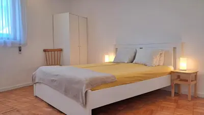 an empty living room with a window and a rug at taol in Vila Nova de Gaia