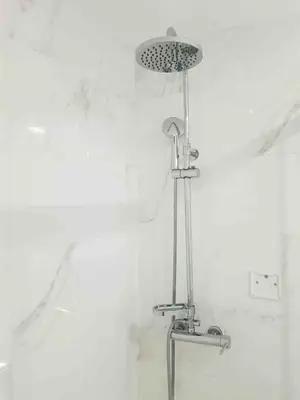 a shower in a bathroom with a white wall at Almada Downtown 104 in Porto