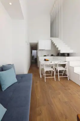 a living room with a couch and a table at RIBEIRA FLORES 59 Downtown Apartments in Porto