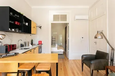 a kitchen with a wooden counter top in a room at Soprano Loft Porto Center - by Guest SPA in Porto