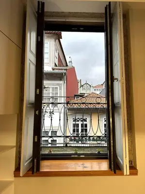 an open window with a view of a building at Almada One in Porto