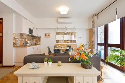 a living room with a couch and a table at Aposentus - Downtown Bright Apartment in Porto