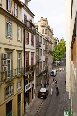 a view of a city street with cars and buildings at Aposentus - Downtown Bright Apartment in Porto