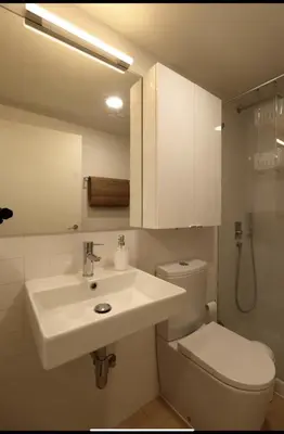 a bathroom with a white sink and a toilet at Rua das Flores Neighborhood in Porto