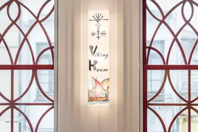 a door with a sign on it next to a window at GuestReady - Rustic urban retreat in Porto