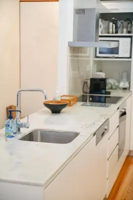 a kitchen with a sink and a counter top at Bolhão Studio, Porto in Porto