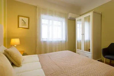a bedroom with a bed and a window at APOSENTUS - Serenity 2D in Porto