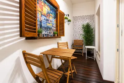 a bathroom with a sink and a mirror and a shower at Cozy apartment in the center of Porto in Porto