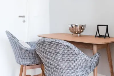 a dining room table with two chairs and a table at GuestReady - Seaside getaway in Porto in Porto