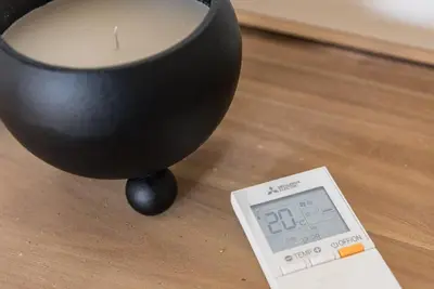 a black vase sitting on a table next to a scale at GuestReady - Seaside getaway in Porto in Porto