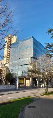 a large glass building on the side of a street at 504 New Apartment Galé in Porto