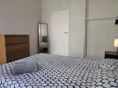a bedroom with a bed and a dresser and a mirror at DISCOVER PORTO - Boavista 2 in Porto