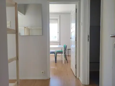 a hallway with a table and a dining room at DISCOVER PORTO - Boavista 2 in Porto