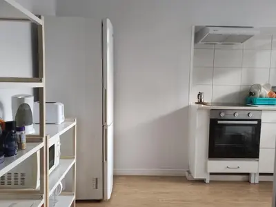 a white kitchen with a stove and a refrigerator at DISCOVER PORTO - Boavista 2 in Porto