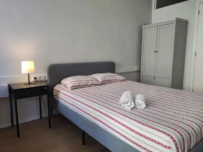 a bedroom with a bed with two white towels on it at DISCOVER PORTO - Boavista 2 in Porto