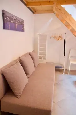 a living room with a couch in a room at Ilhas Douro Fontaínhas by PA Hotels in Porto