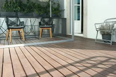 a pair of chairs sitting on a deck at Maria Pia Luxury Apartment, Historic House Downtow in Porto