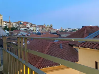 a view of a city from a balcony at Maria Pia Luxury Apartment, Historic House Downtow in Porto