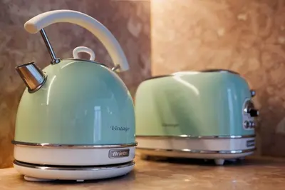 two toasters sitting next to each other on a counter at Maria Pia Luxury Apartment, Historic House Downtow in Porto