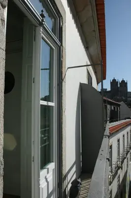 an open door on a building with a balcony at Maria Pia Luxury Apartment, Historic House Downtow in Porto
