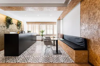 a living room with a table and a counter at GuestReady - Portfolio GuestHouse in Porto