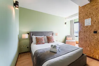 a bedroom with a large bed in a room at GuestReady - Portfolio GuestHouse in Porto