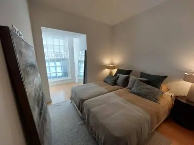 a bedroom with a large bed and a window at Dream On - Aliados Delux 2 Bed in Porto