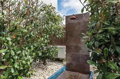 a garden with two trees and a building at Porto InLapa Apartment II Terrace in Porto