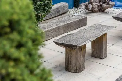 a wooden bench sitting on top of a sidewalk at Porto InLapa Apartment II Terrace in Porto