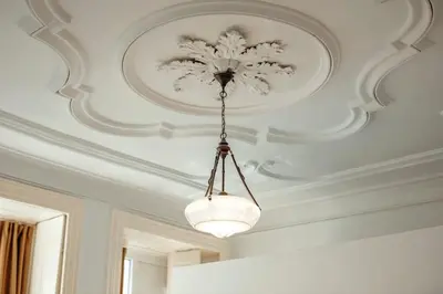 a ceiling with a chandelier in a room at InLapa Studio III in Porto
