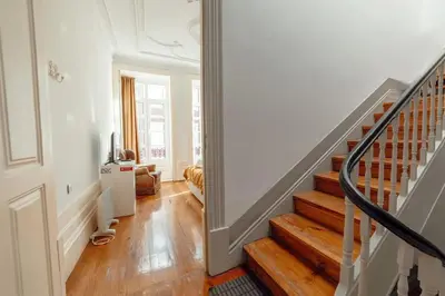a staircase in a home with wooden floors at InLapa Studio III in Porto