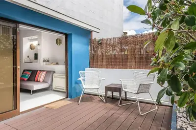a patio with two chairs and a couch at Porto InLapa Studio VI Garden in Porto