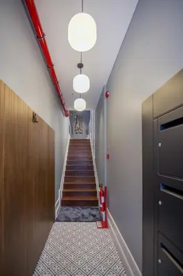 a hallway with a stairway with a stair case at Porto Almada 180 Apartments in Porto